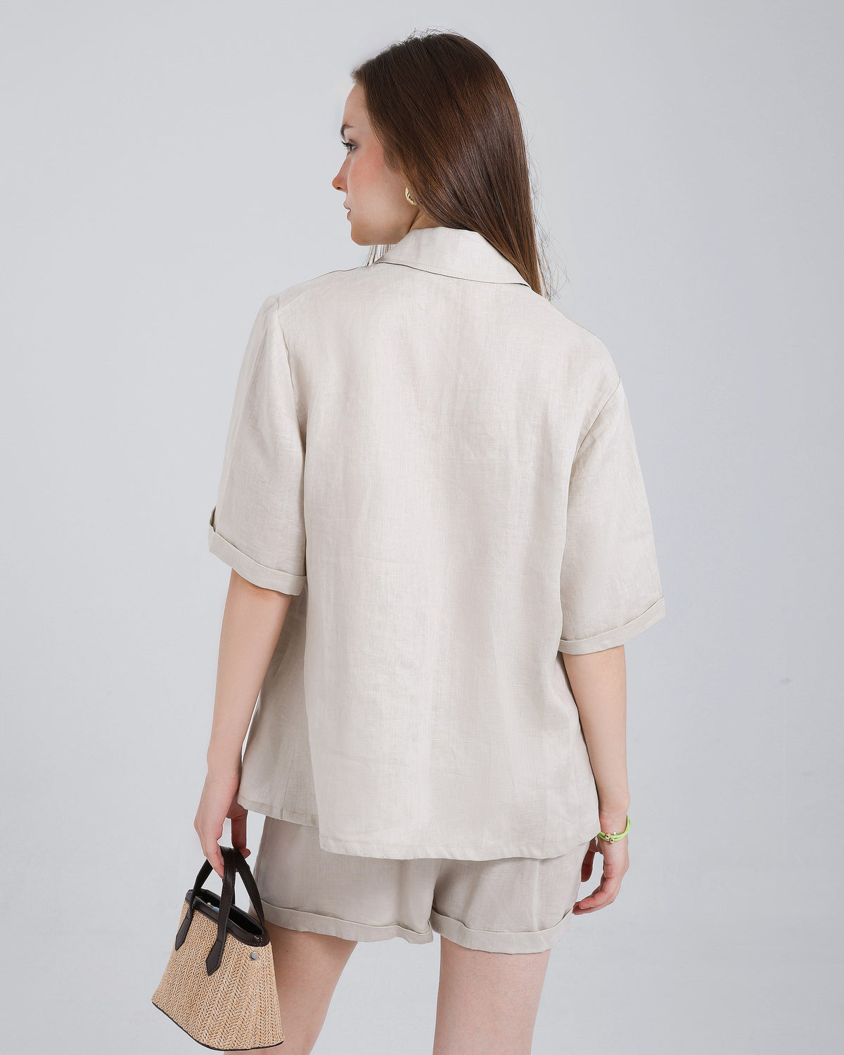 Ibiza Set seen from behind — oatmeal linen camp shirt with matching shorts